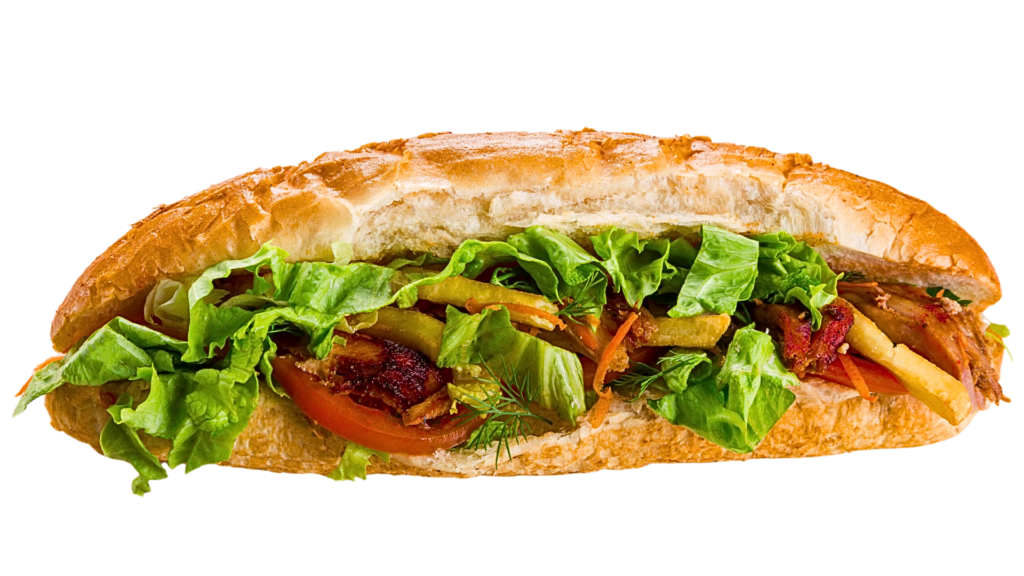 Appetizing Middle Eastern sandwich filled with grilled meat, crispy lettuce, tomato slices, pickles, and fries, served in a crusty baguette-style bread.